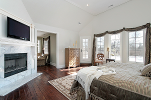 Master bedroom in new construction home with fireplace